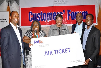 (L-r): Sule Umar Bichi, managing director, Red Star Express, Ms. Ejine Nzeribe, Author of Inspiring Growth: the history of Red Star Express,; Ms. Binta Max-Gbinije, chief executive officer, Stanbic IBTC Trustees Ltd, Muyiwa Olumekun, executive director, Red Star Express Plc, and Ademola Adepegba of Greenlife Pharmaceuticals Ltd and the st prize winner of the raffle draw held at the 2013 Red Star Express Customers Forum in Lagos